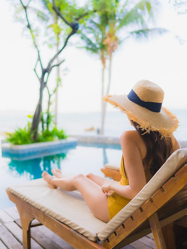 Portrait beautiful young asian women happy smile relax around outdoor swimming pool in hotel resort for travel vacation