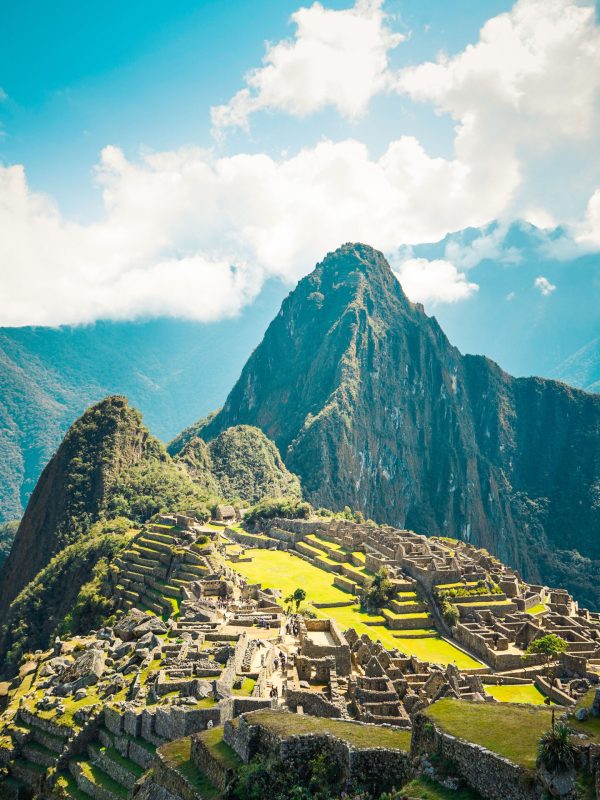 A landscape view of the Machu Picchu Historical place in Peru under blue sky